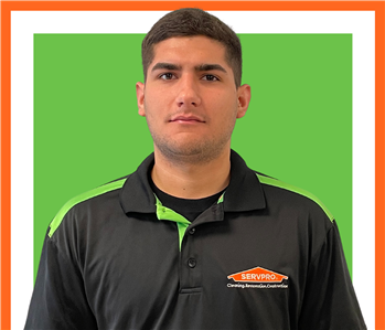 male employee against green background