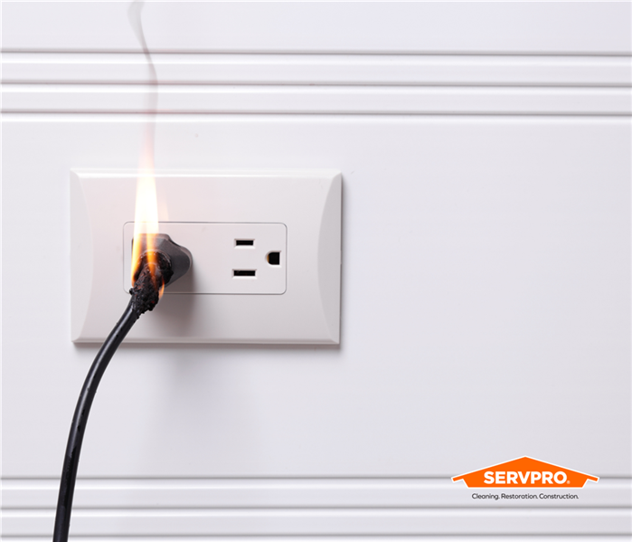 plug in a socket with a spark and flame in Fort Worth, TX